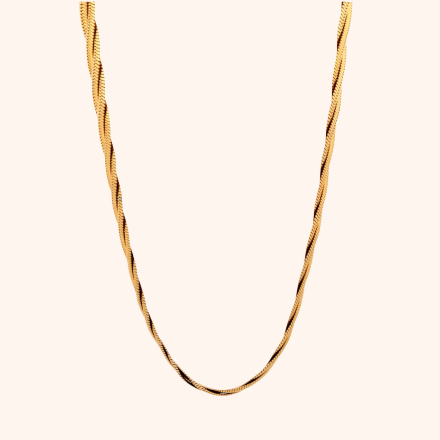 Detailed view of a gold twisted herringbone chain necklace, highlighting its smooth, fluid texture and elegant drape.